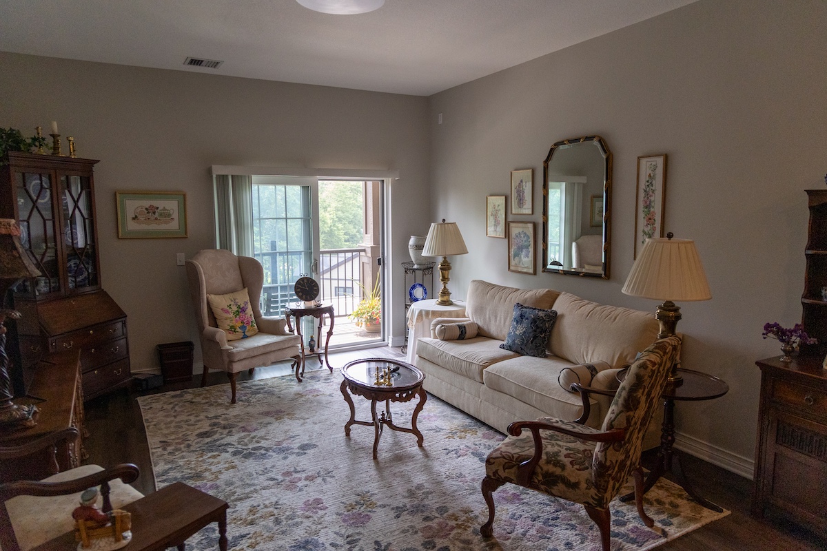 a living room filled with furniture and a fireplace