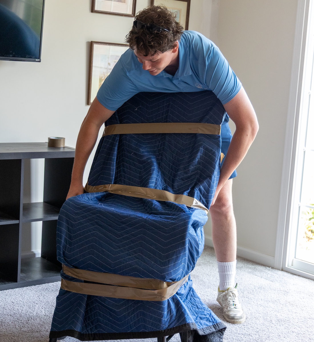 a man in a blue suitcase
