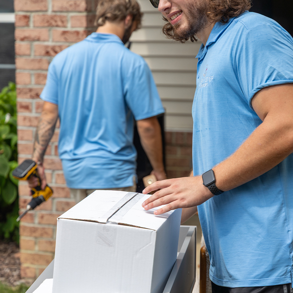 a man standing in front of a computer